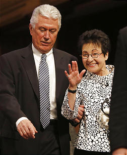 President Dieter F. Uchtdorf and Sister Harriet Uchtdorf walk onto the stand prior to speaking Sunday, Feb. 9, 2014 at a devotional for Bountiful Utah Temple workers inside the Tabernacle on Temple Square.