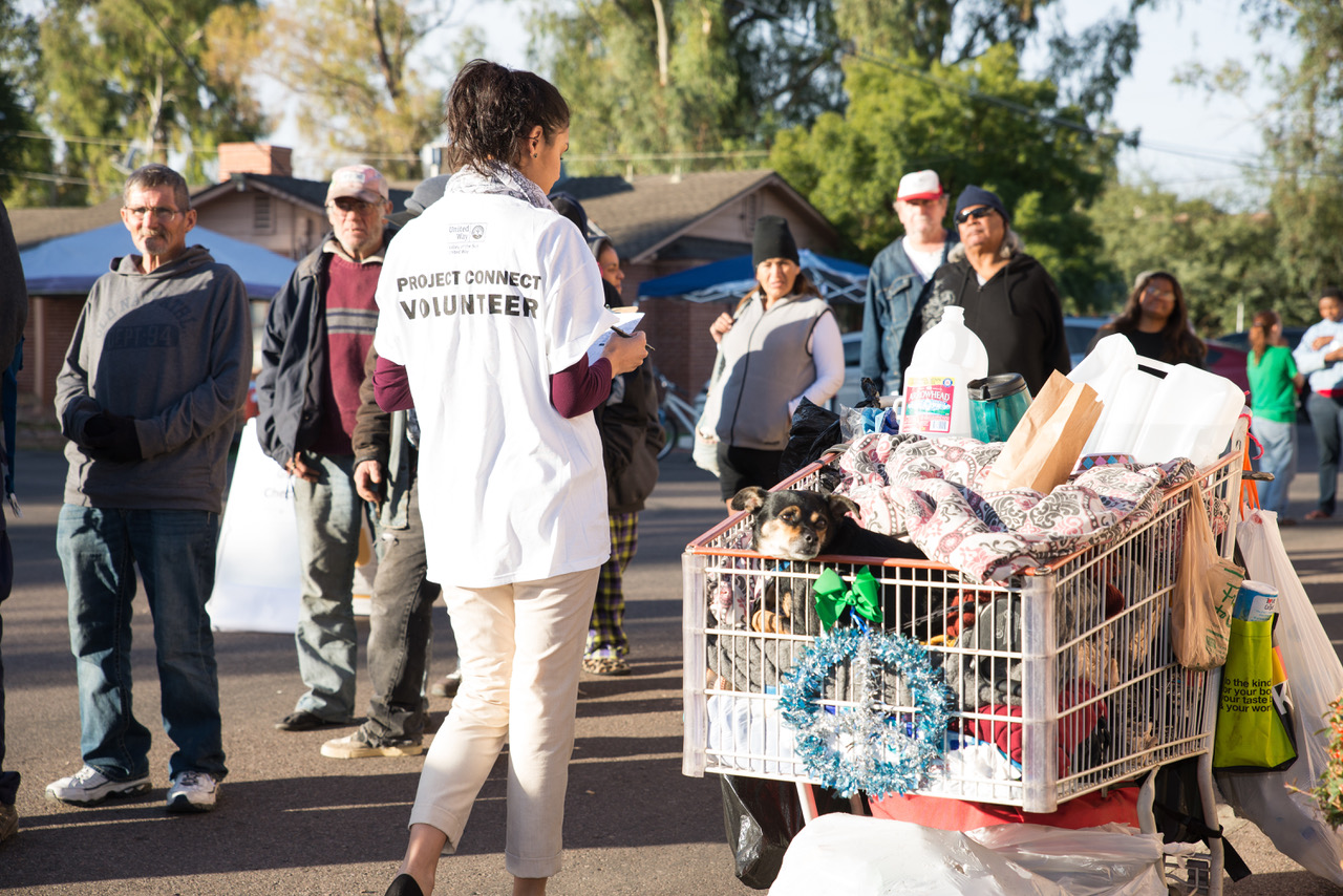 A volunteer helps to register individuals experiencing homelessness during a recent Project Connect event in Phoenix, Arizona.