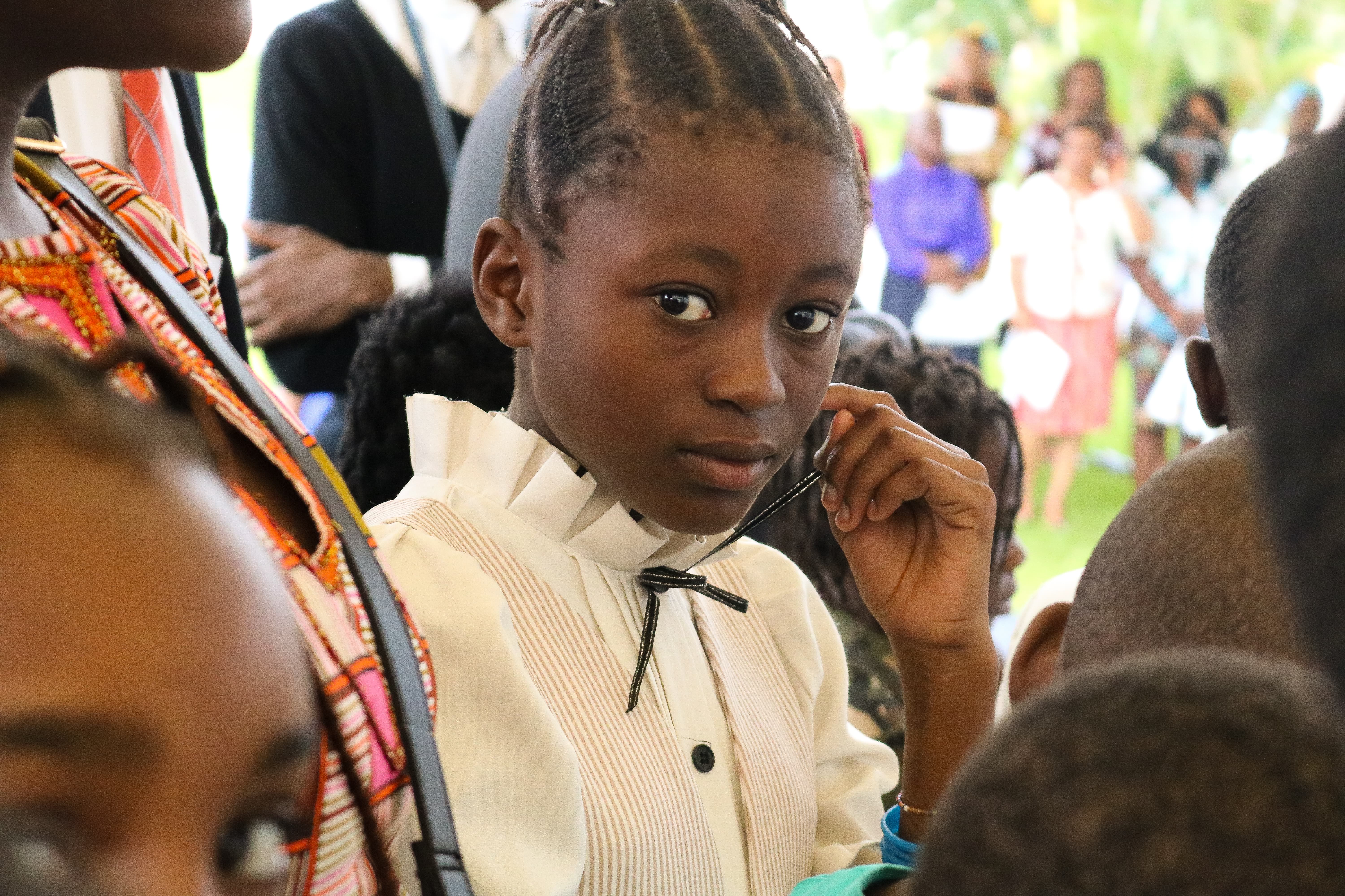 A young Latter-day Saint child attends the cornerstone ceremony in conjunction with the dedication of the Kinshasa Democratic Republic of the Congo Temple on Sunday, April 14, 2019.