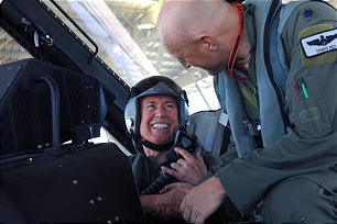 President Dieter F. Uchtdorf receives greeting from Travis Rex, the Hill AFB pilot who took him on a flight in an F-16 jet fighter. President Uchtdorf spoke warmly of those who dedicate their lives in the service of their country.