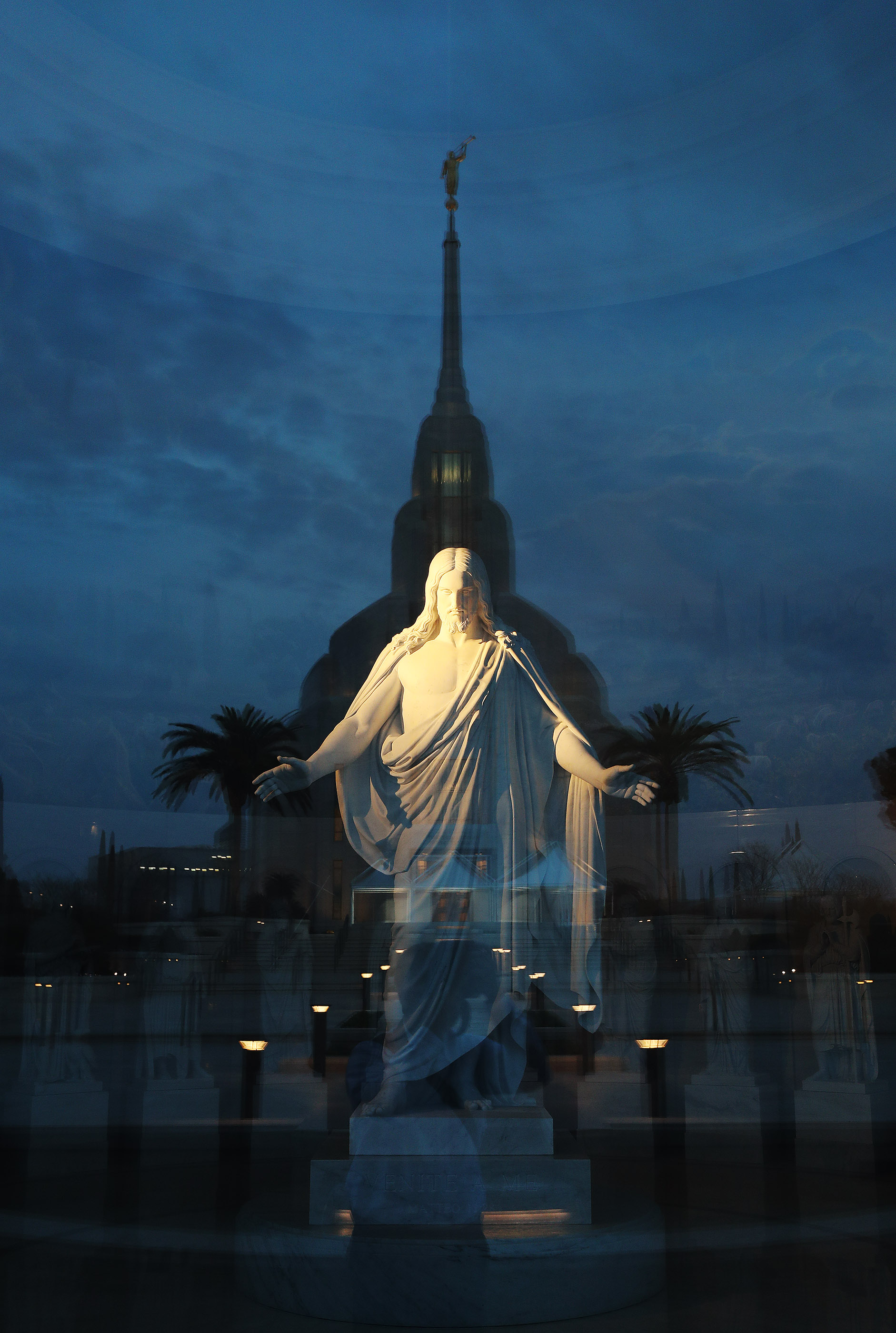 The Christus is illuminated in the Rome Italy Temple Visitors' center with a reflection of the temple in Rome, Italy, on Friday, March 8, 2019.