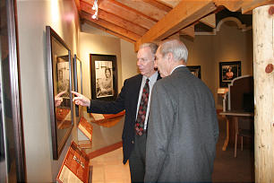 Ray Halls discusses elements of the exhibit with museum volunteer Donis Meiners.