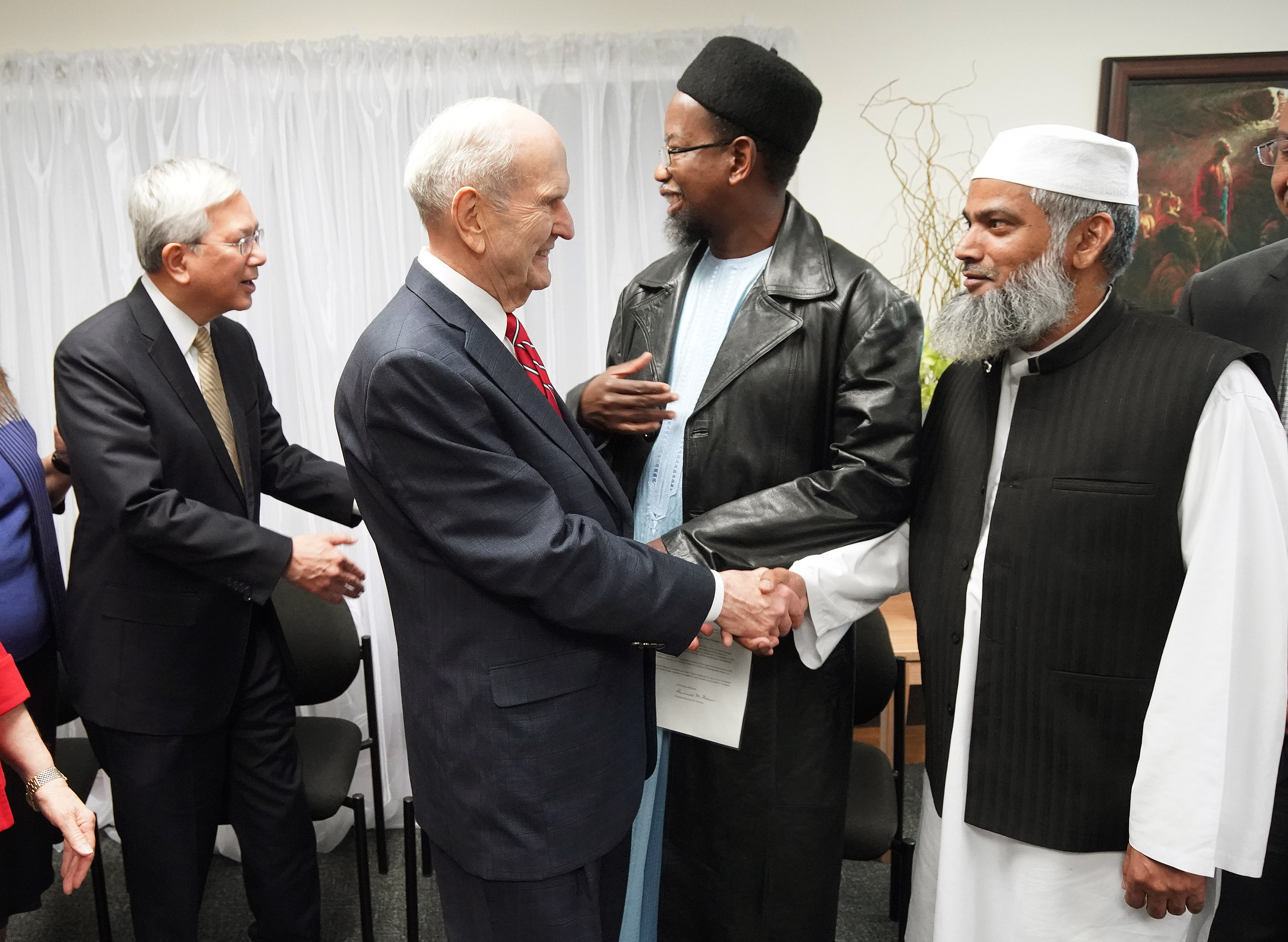 President Russell M. Nelson of The Church of Jesus Christ of Latter-day Saints greets Sheik Mohammad Amir and Elder Gerrit W. Gong, of The Church of Jesus Christ of Latter-day Saints’ Quorum of the Twelve Apostles, shakes hands with Dr. Mustafa Farouk in Auckland, New Zealand on May 21, 2019.