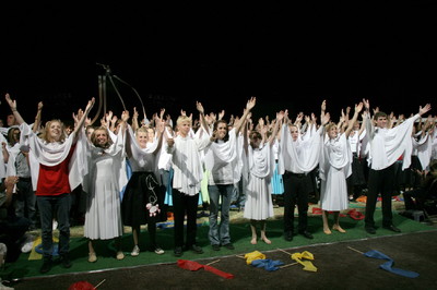 In the final moments of the cultural celebration, hundreds of youth — draped in white capes — celebrated the coming of a temple to eastern Arizona.