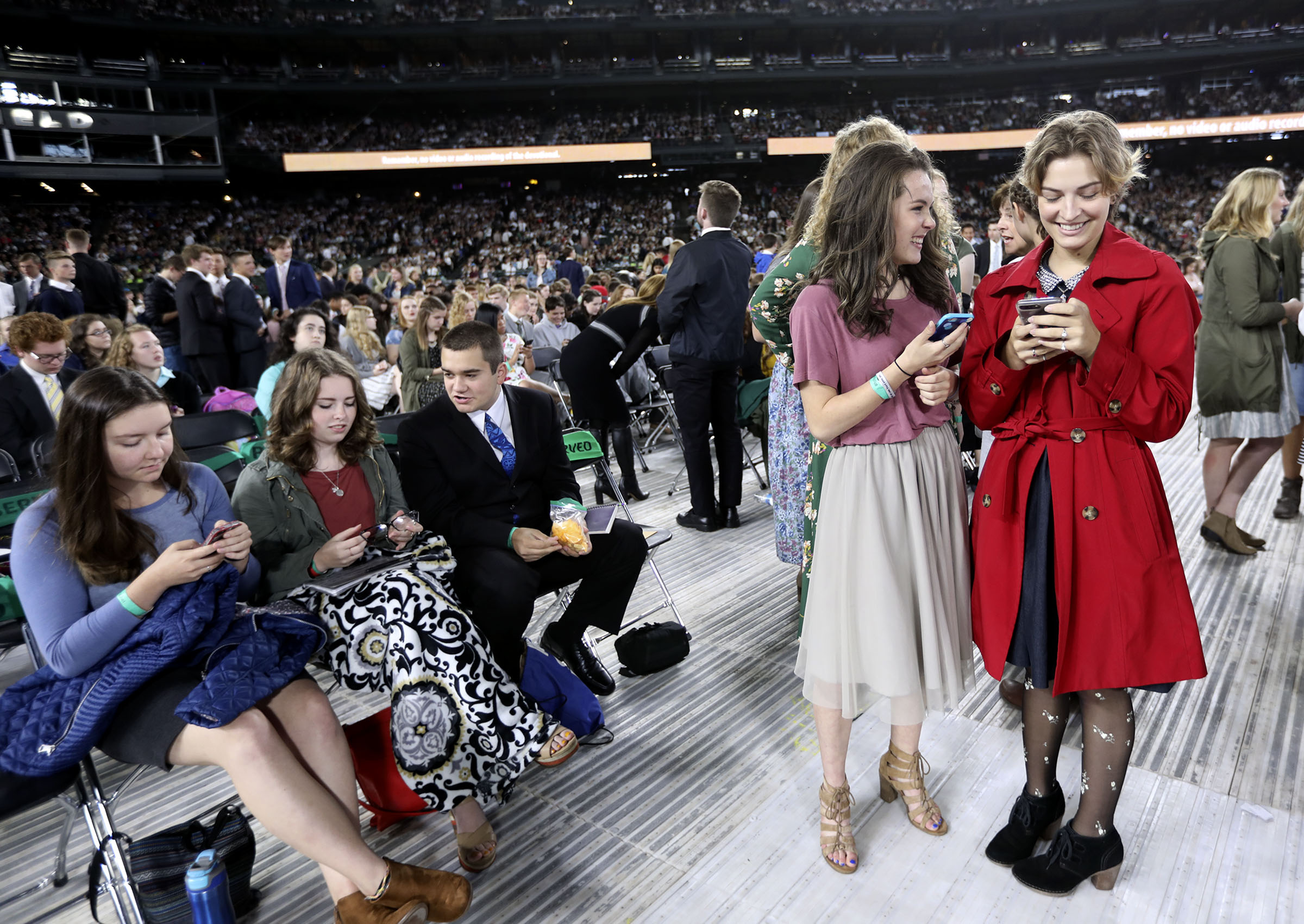 Teens wait for President Russell M. Nelson of The Church of Jesus Christ of Latter-day Saints to speak at Safeco Field in Seattle, Wash., on Saturday, Sept. 15, 2018.