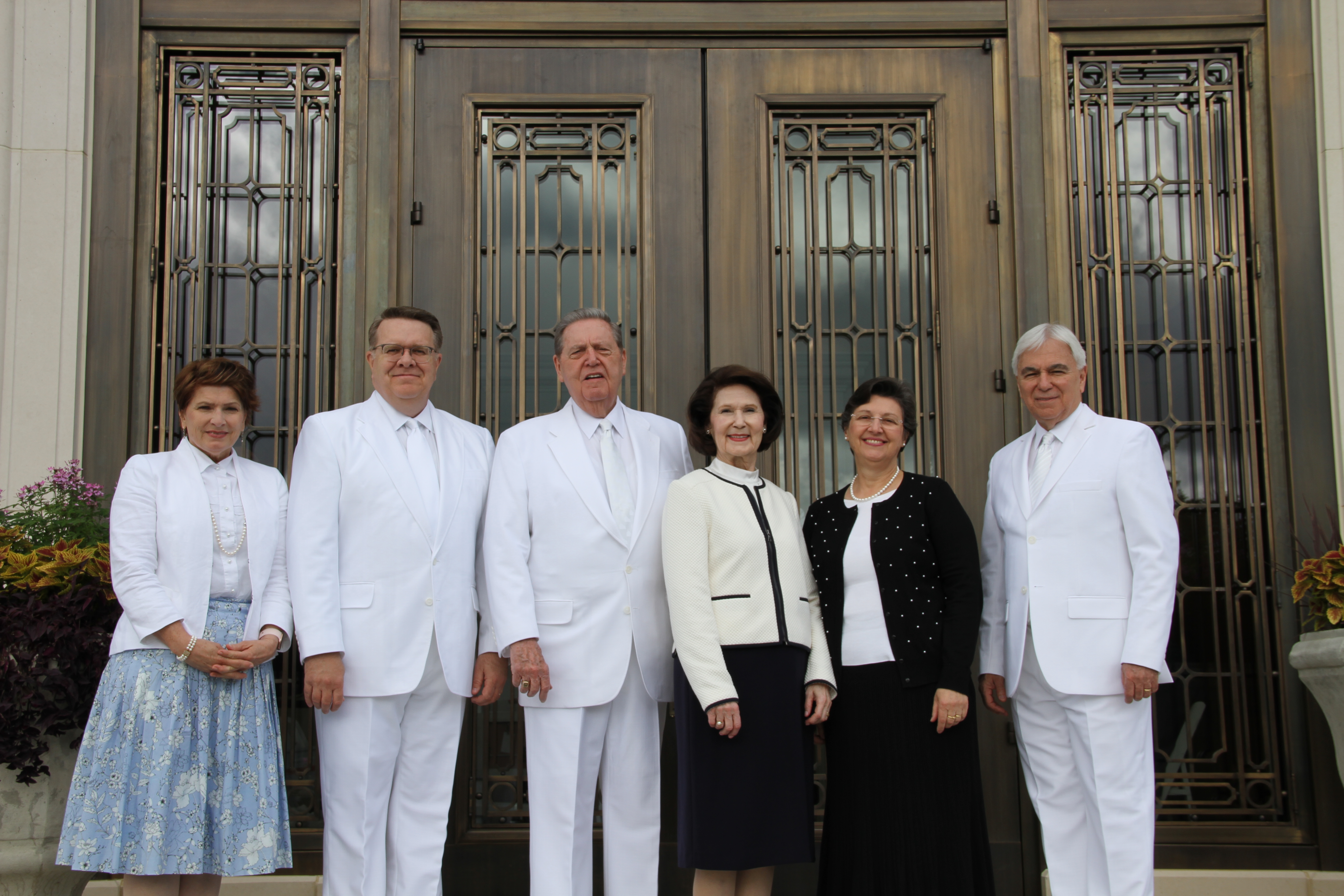 From left, Sister Jeri Whiting, Elder Scott D. Whiting, Elder Jeffrey R. Holland, Sister Patricia Holland, Sister Margareth Costa and Elder Claudio R. M. Costa pose in front of the temple prior to the rededication ceremony on May 5, 2019.