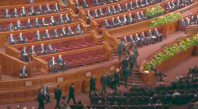 Newly called General Authorities take seats on the stand in the Conference Center during the Saturday afternoon session of general conference.
