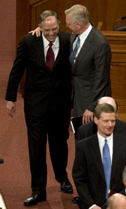 Elder Neil L. Andersen, the newest member of the Quorum of Twelve Apostles, is hugged by Elder D. Todd Christofferson after the Saturday morning session of the 179th Annual General Conference.