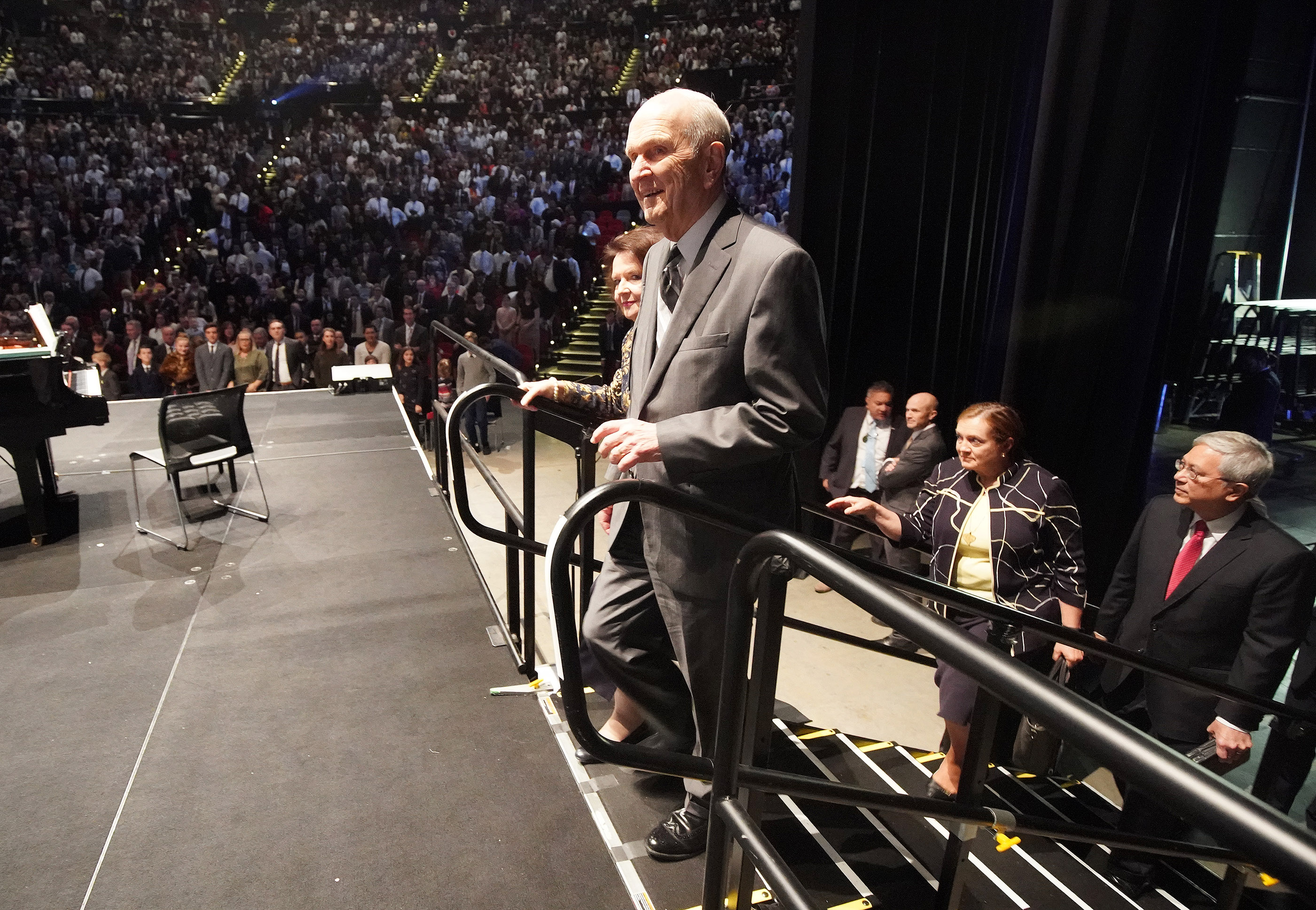 President Russell M. Nelson of The Church of Jesus Christ of Latter-day Saints and his wife Sister Wendy Nelson walk on stage at the International Conference Center to speak on May 19, 2019 in Sydney, Australia. Elder Elder Gerrit W. Gong, of The Church of Jesus Christ of Latter-day Saints’ Quorum of the Twelve Apostles, and his wife Sister Susan Gong follow.