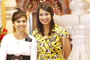 A pair of sister missionaries serve as guides at the Mexico City Temple Visitors Center.
