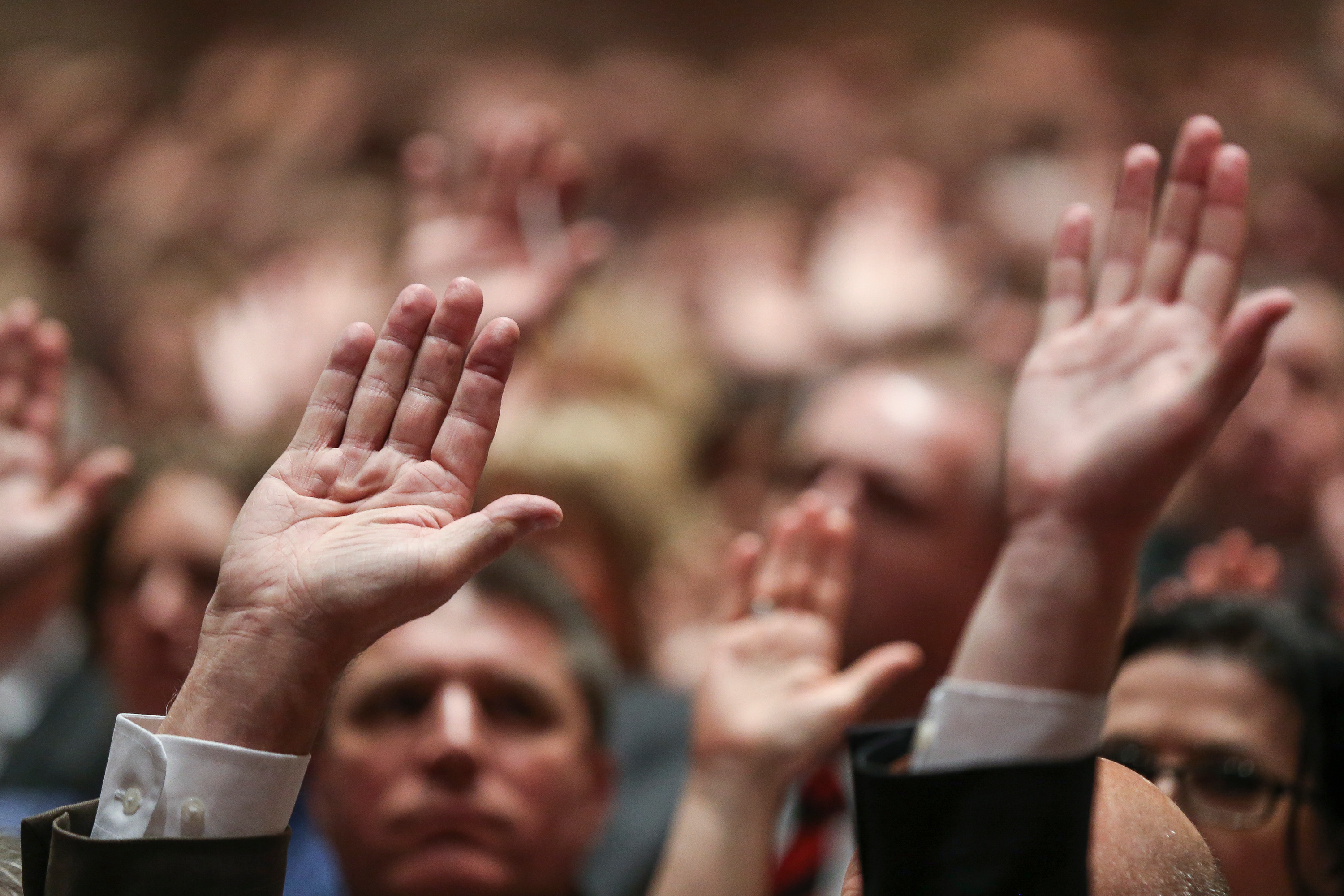 Conferencegoers raise their hands to sustain church leadership during the Saturday afternoon session of the 188th Annual General Conference of the LDS Church at the Conference Center in Salt Lake City on March 31, 2018.