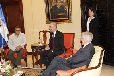President Henry B. Eyring, center, with El Salvador President Mauricio Funes, left, and Elder D. Todd Christofferson in the presidential palace. The woman standing behind is a translator.