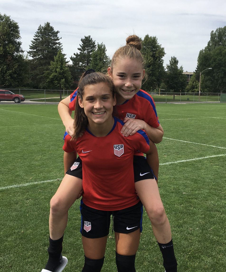 Olivia Moultrie with a friend at a national youth division soccer camp.