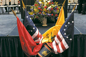 Flags, flowers are placed in memorial.