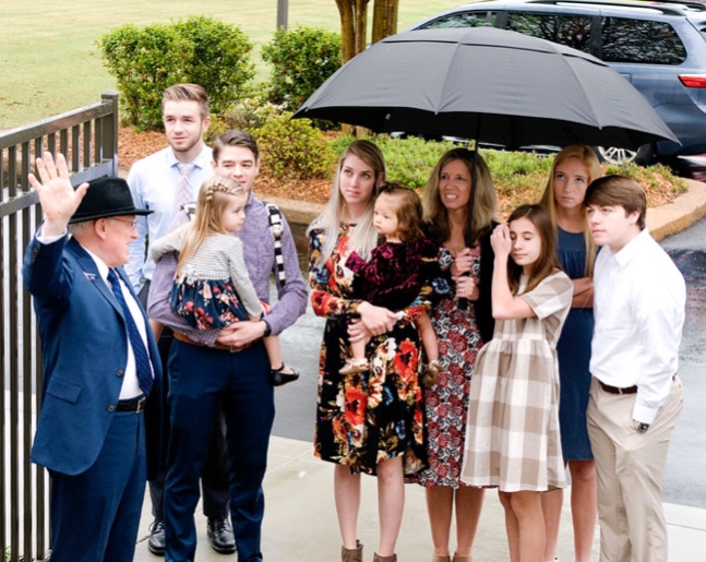 Visitors arrive for the Memphis Tennessee Temple open house on a rainy day in April 2019.
