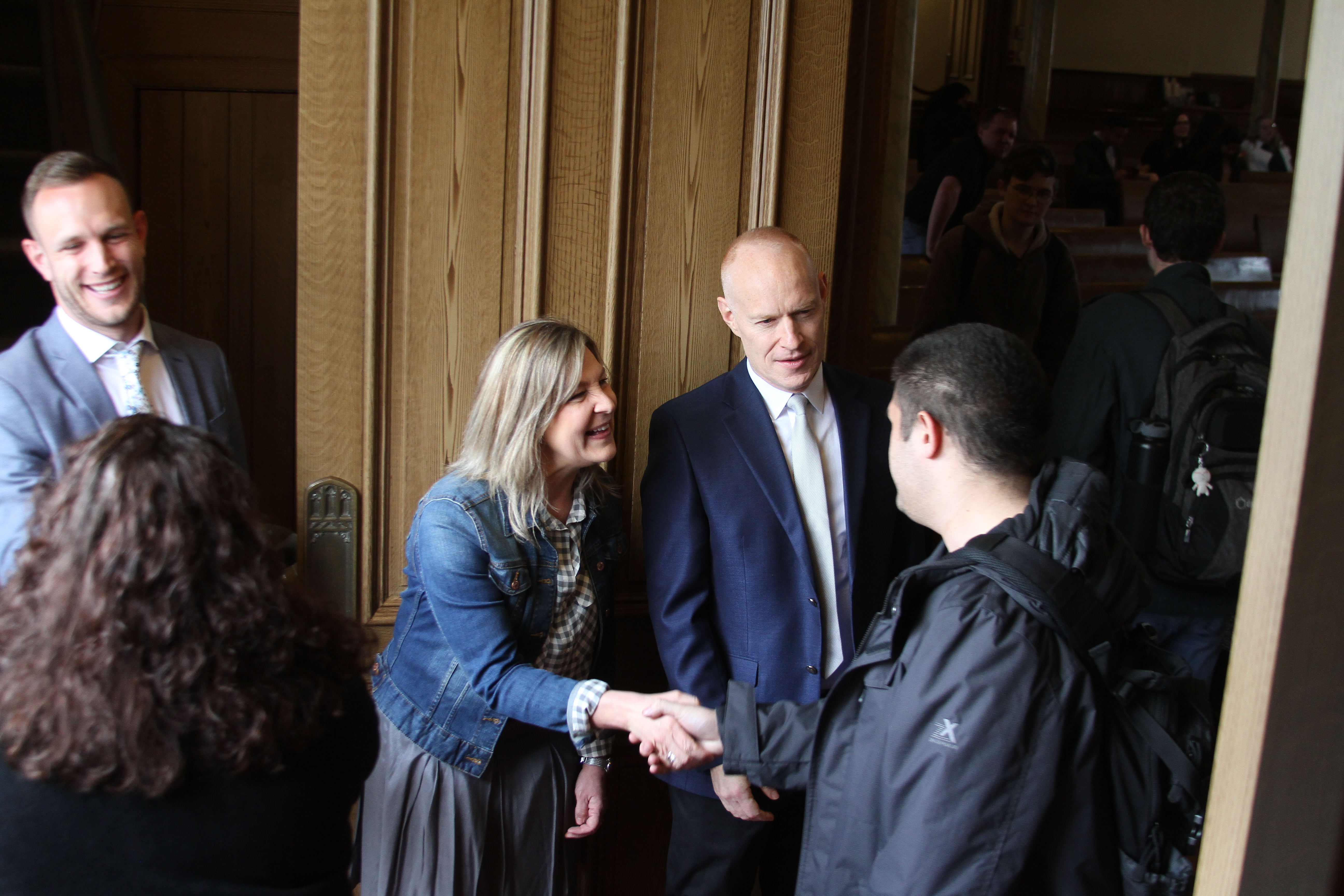 Michelle and Jon Schmidt greet LDS Business College students as they enter the Assembly Hall on Temple Square on March 26, 2019.