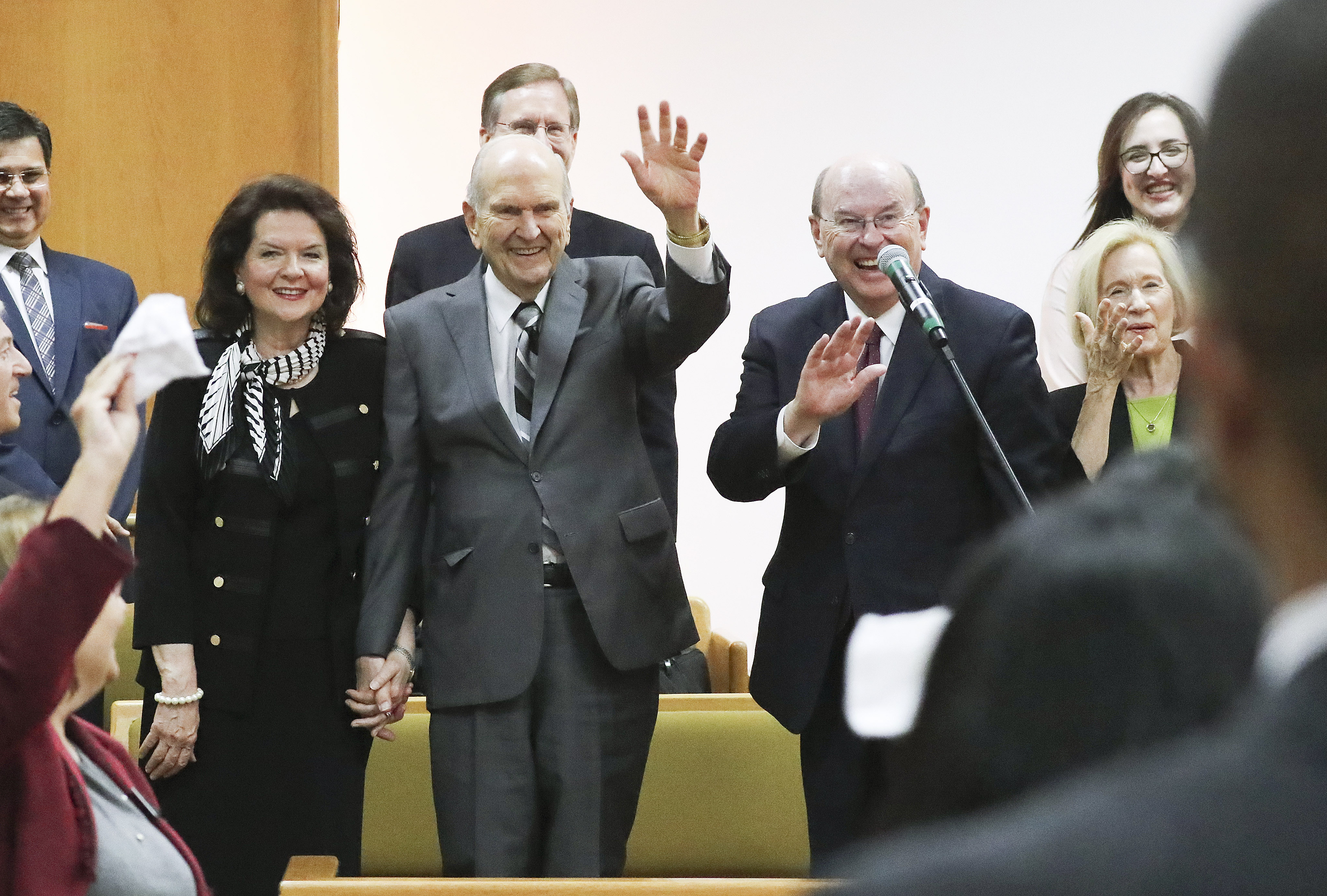 President Russell M. Nelson of The Church of Jesus Christ of Latter-day Saints and his wife, Sister Wendy Nelson, with Elder Quentin L. Cook, Quorum of the Twelve Apostles, and his wife, Sister Mary Cook wave to missionaries after speaking during a Brazil Brasilia Mission meeting in Brasilia, Brazil, on Friday, Aug. 30, 2019.