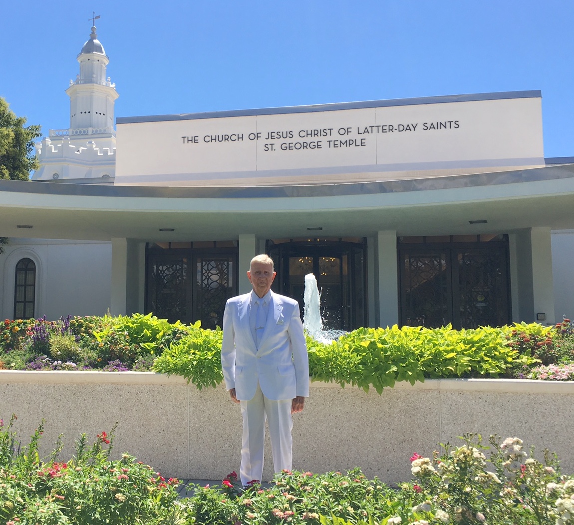Carl Freeman, 104, stands outside the St. George Utah Temple where he work in the baptistry and at the recommend desk.
