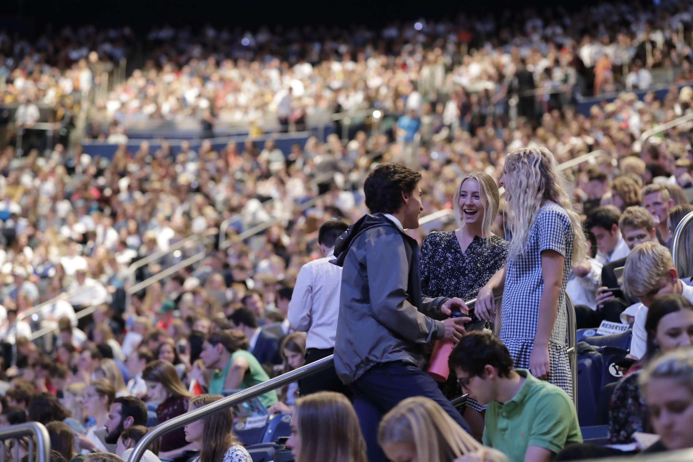 Students take their seats in the Marriott Center on BYU campus in preparation for a devotional by President Russell M. Nelson on Tuesday, Sept. 17, 2019.