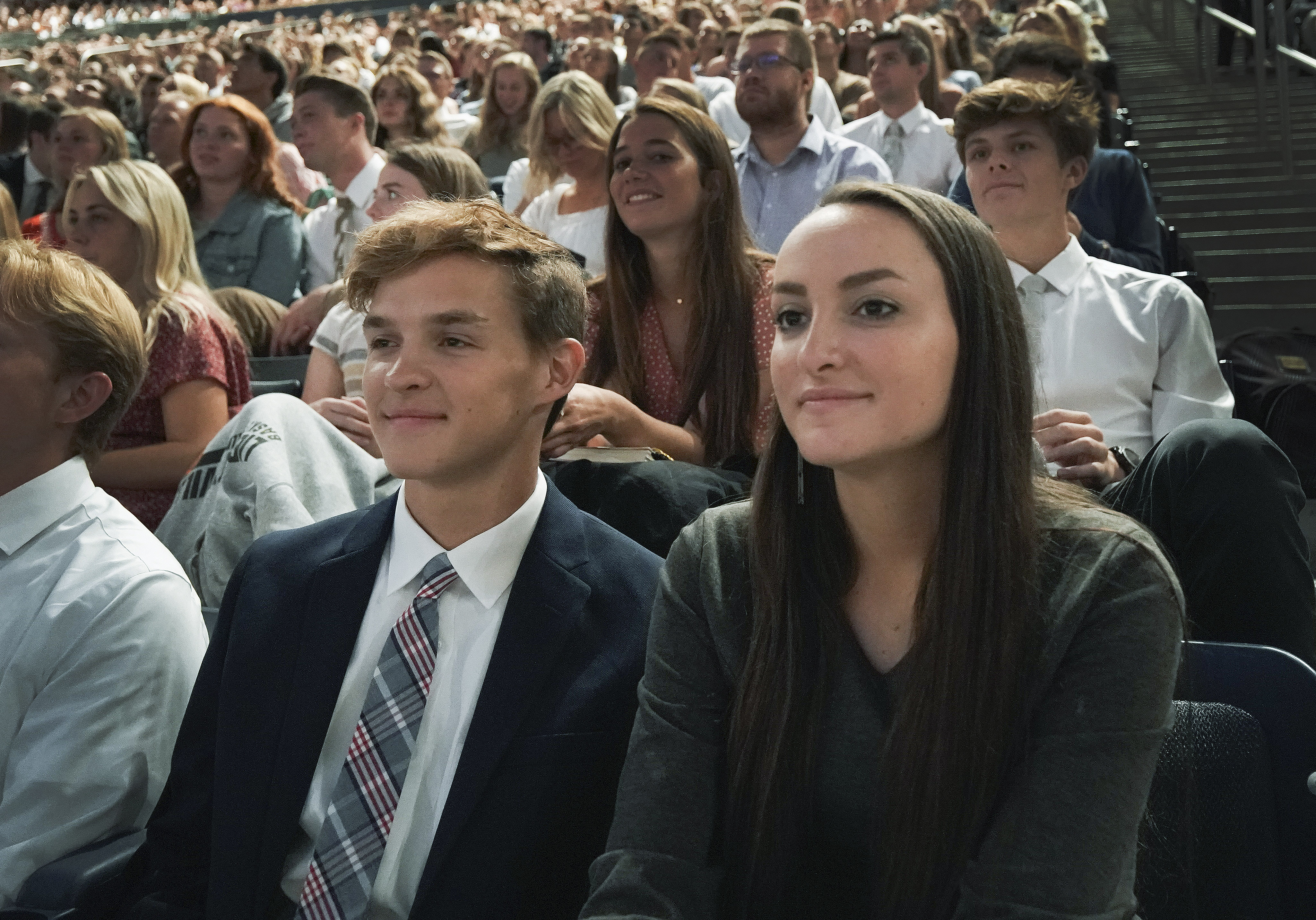 Garrett and Madison Brown, brother and sister, listen to President Russell M. Nelson of The Church of Jesus Christ of Latter-day Saints during a devotional at Brigham Young University in Provo on Tuesday, Sept. 17, 2019.
