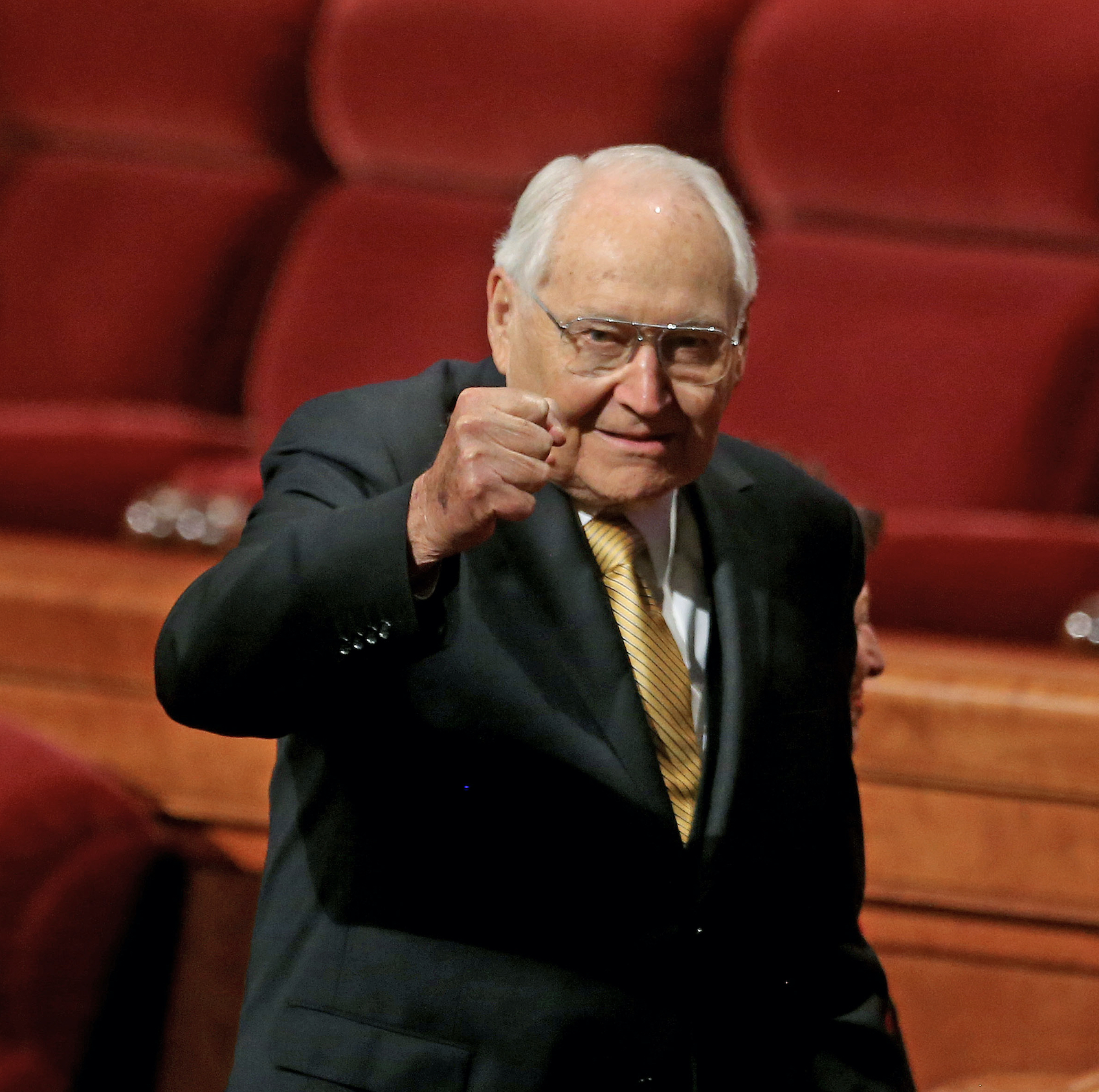 Elder L. Tom Perry of the Quorum of the Twelve Apostles pumps his fist.