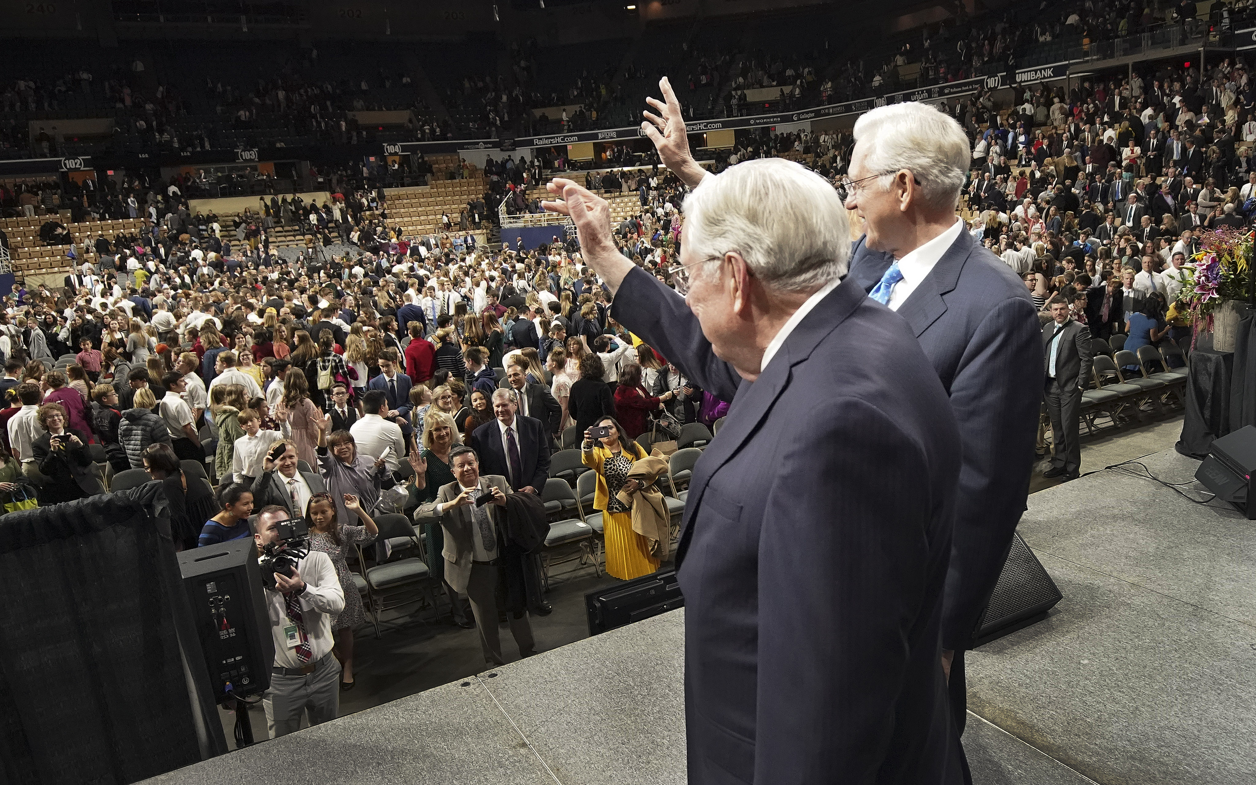 President M. Russell Ballard, acting president of the Quorum of the Twelve Apostles of The Church of Jesus Christ of Latter-day Saints, and Elder D. Todd Christofferson, of the Quorum of the Twelve Apostles, wave to attendees after a devotional in Worcester, Massachusetts, on Sunday, Oct. 20, 2019.