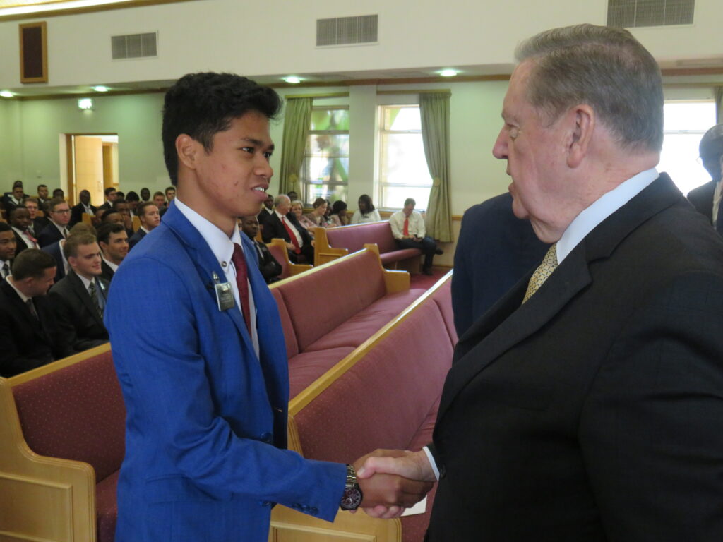 Elder Jeffrey R. Holland of the Quorum of the Twelve Apostles shakes a missionary's hand in a Latter-day Saint meetinghouse in Johannesburg, South Africa, on Monday, Nov. 11, 2019. Elder Holland spoke to missionaries from the Johannesburg and Botswana missions and the Johannesburg MTC.
