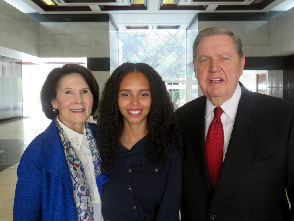 Sister Patricia Holland, left, and Elder Jeffrey R. Holland, right, stand with Judith Mahlangu, middle, a recently returned missionary, following a multi-stake conference at the Gallagher Convention Center near Johannesburg, South Africa, on Sunday, Nov. 10, 2019.