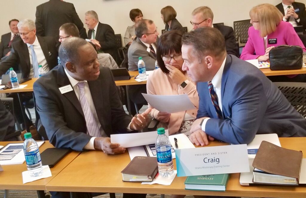 President Paul W. Craig, right, and Sister Nadine Craig, new president and companion for the Ghana Missionary Training Center, review schedules with Mathias Eguko, the Ghana MTC's manager of operations, during the 2020 MTC Leadership Seminar Jan. 14, 2020, at the Provo MTC in Provo, Utah.