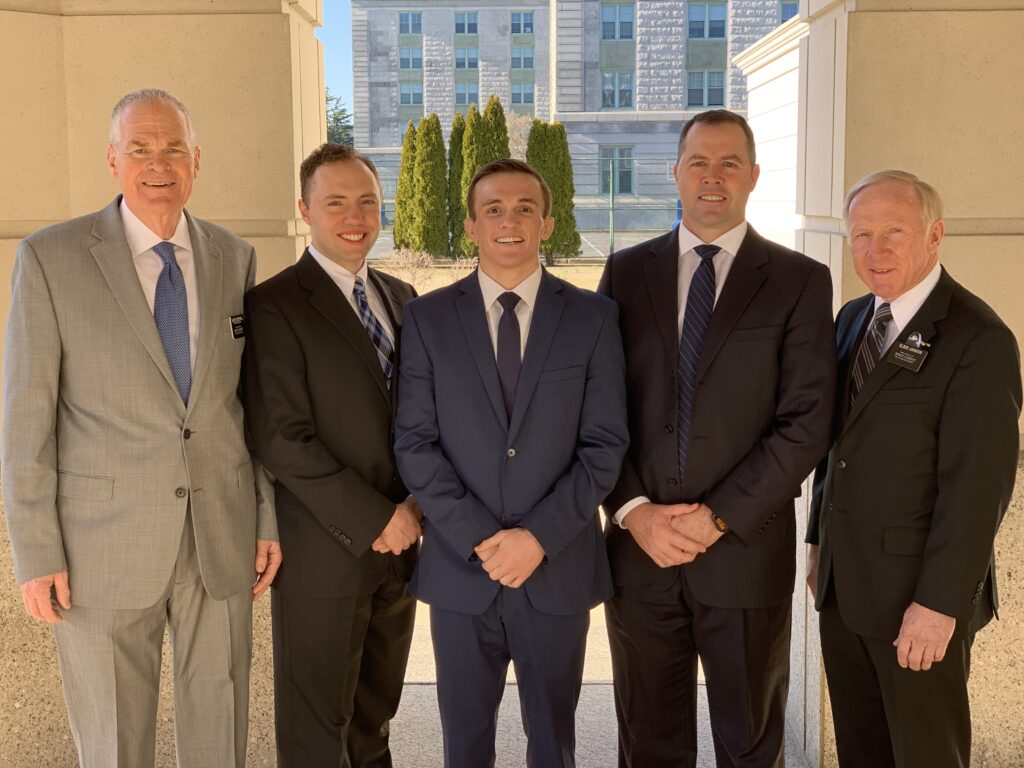 Navy wrestler Casey Cobb, center, serves as the second counselor in the recently-formed Naval Academy Branch. Cobb's joined by fellow members of presidency, from left, Elder Lyn Loyd Creswell, first counselor; Christopher Vincent, branch executive secretary; Casey Cobb; Branch President Joe DuPaix; Elder Dennis Johnson, branch clerk.