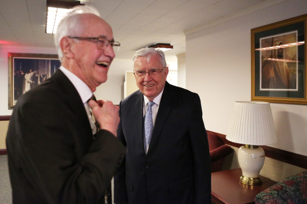 President M. Russell Ballard, acting president of the Quorum of the Twelve Apostles, shares laugh with Bruce Smith upon meeting at the Brampton Stake Center in Brampton, Ontario, Canada, March 6, 2020.